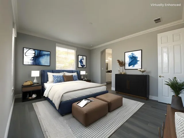 a bedroom with a bed and a couch