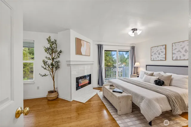 a bedroom with a bed and a fireplace