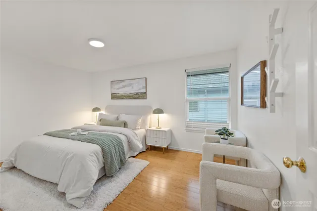 a bedroom with a bed and a couch