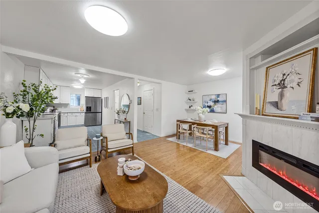 a living room with furniture and a potted plant