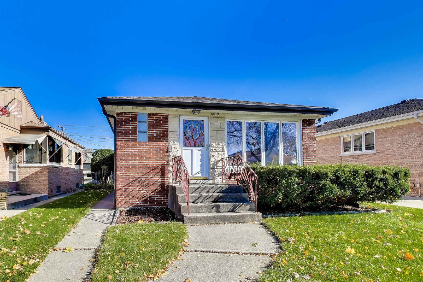 a view of a house with backyard sitting area and garden