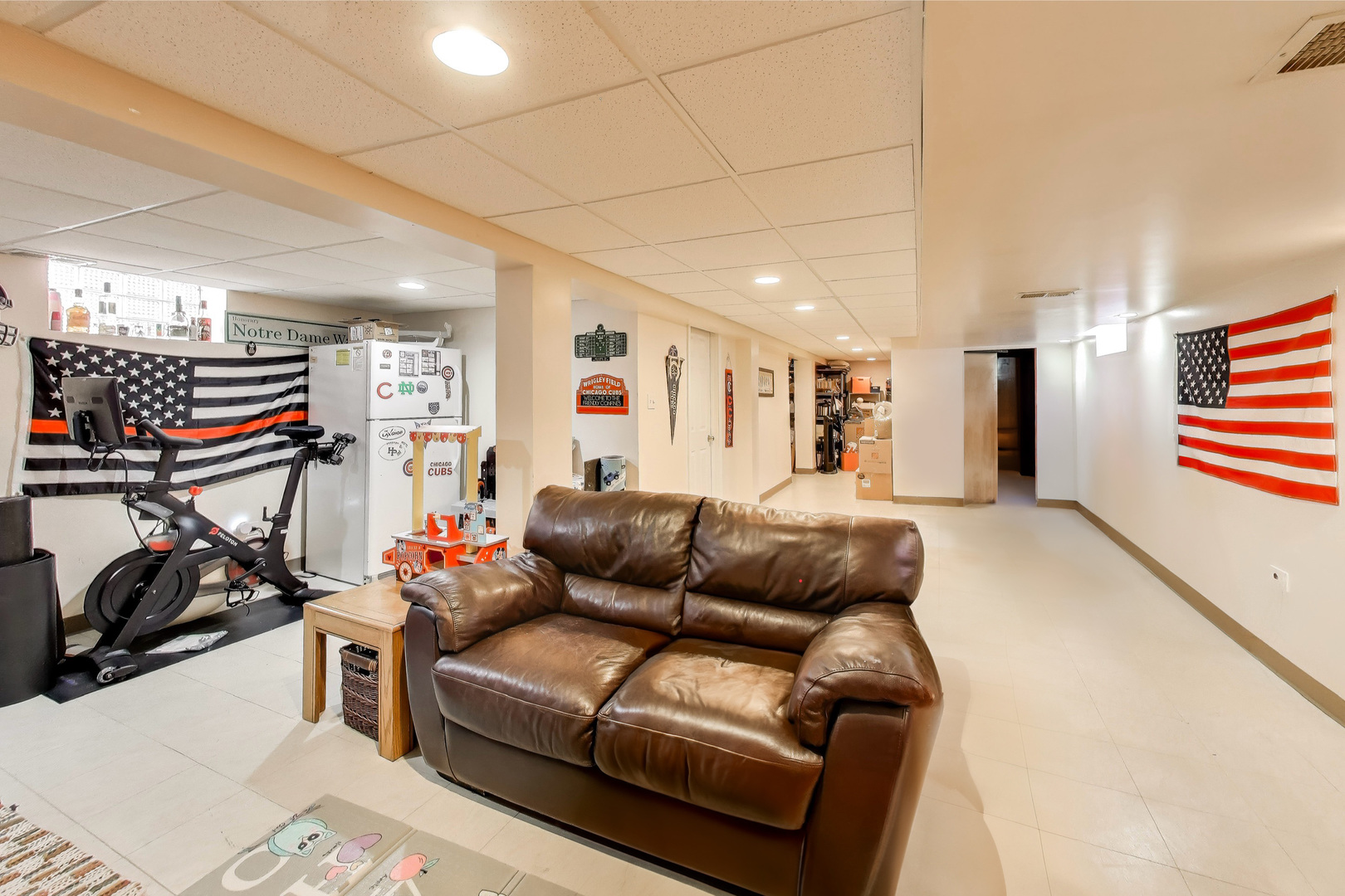 8049 North Osceola Avenue Niles, IL 60714 - Photo 2 of 7 a living room with furniture and a gym machine