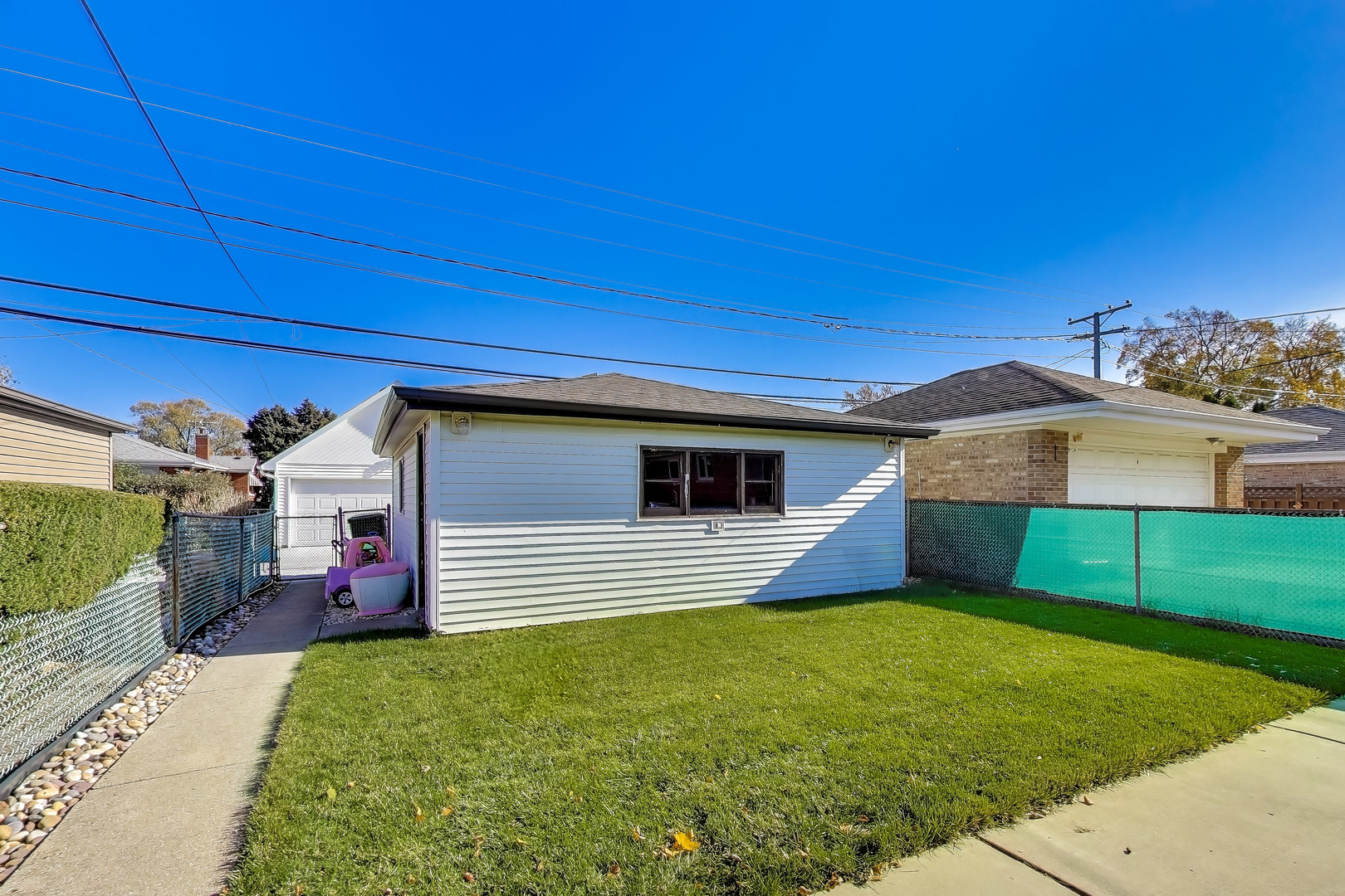 8049 North Osceola Avenue Niles, IL 60714 - Photo 3 of 7 a front view of house with yard
