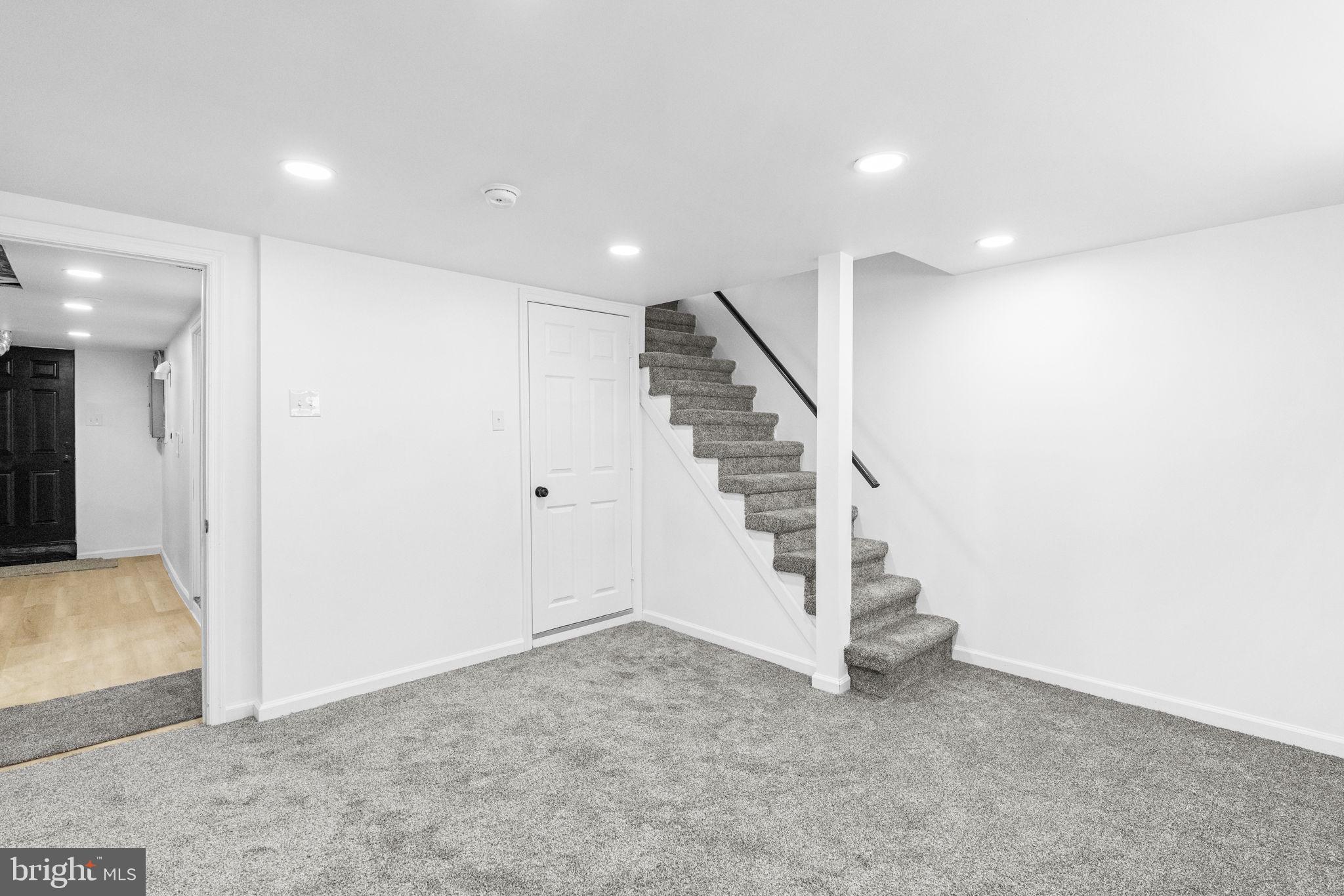 7703 Gilbert Street Philadelphia, PA 19150 - Photo 12 of 37 a view of a hallway with staircase