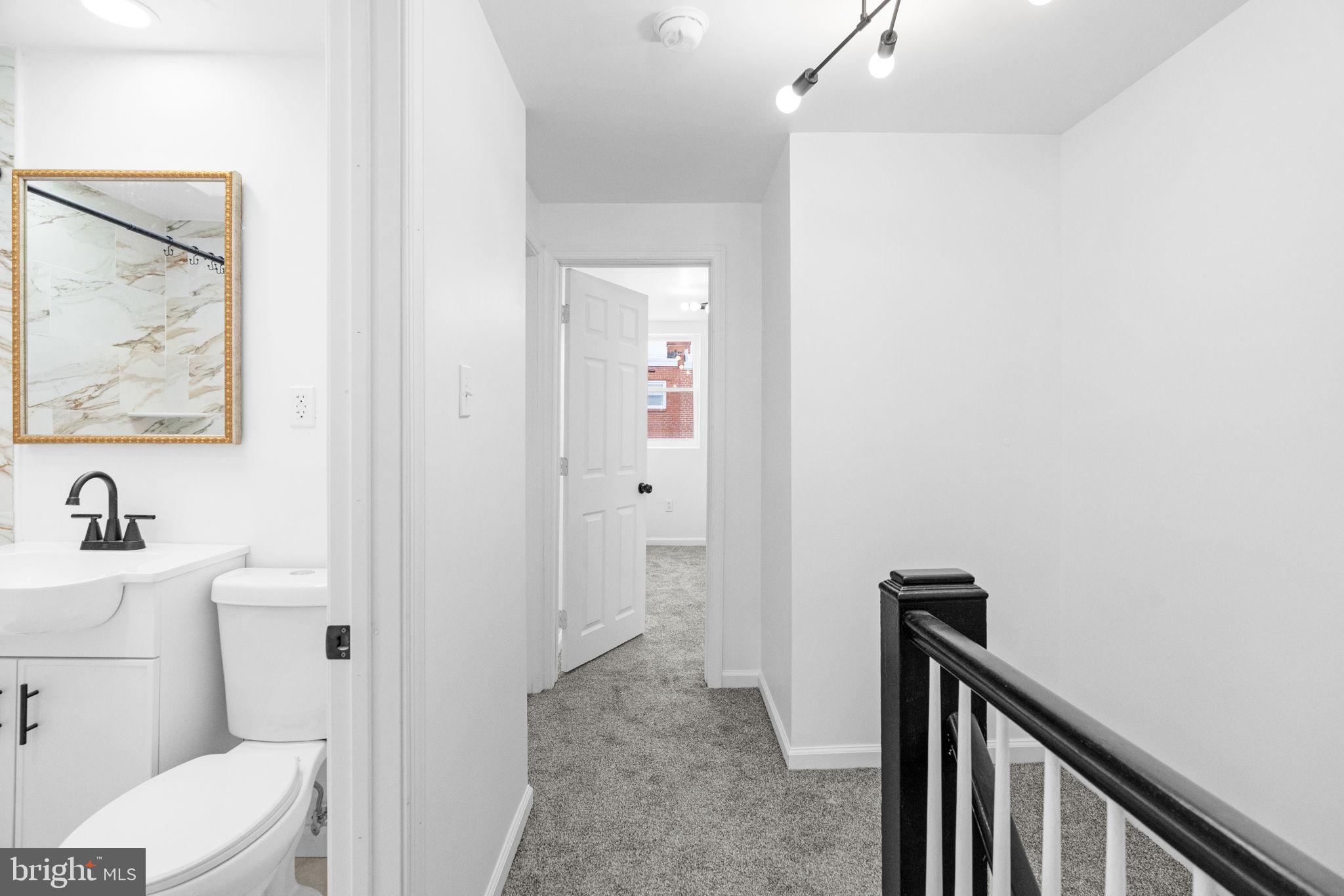7703 Gilbert Street Philadelphia, PA 19150 - Photo 21 of 37 a bathroom with a sink and toilet