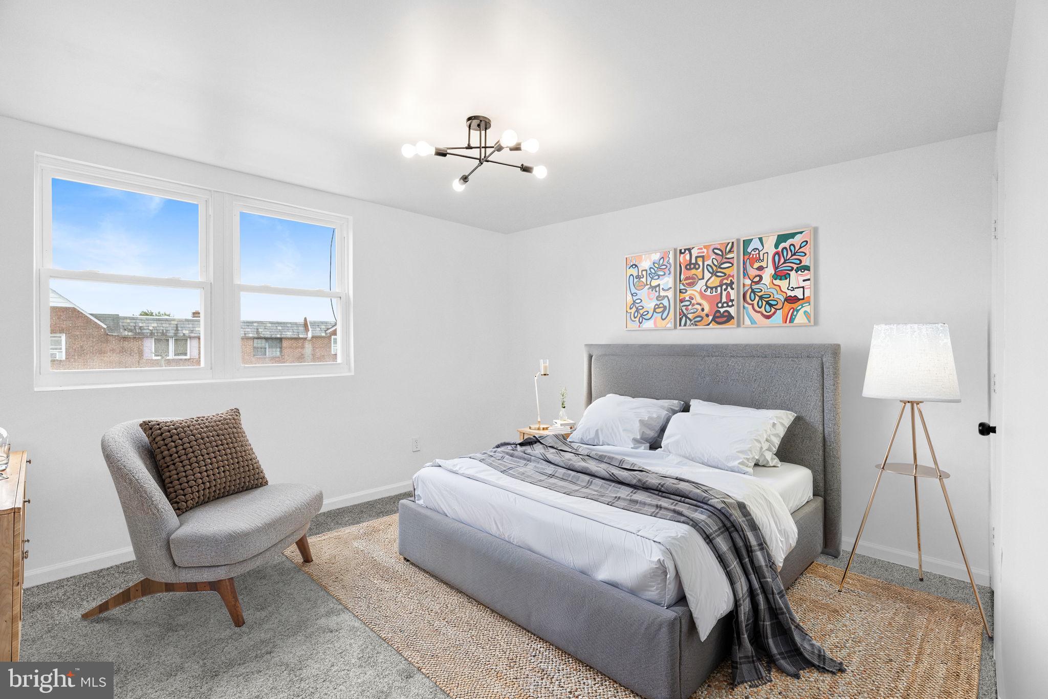 7703 Gilbert Street Philadelphia, PA 19150 - Photo 23 of 37 a bedroom with a bed and a lamp