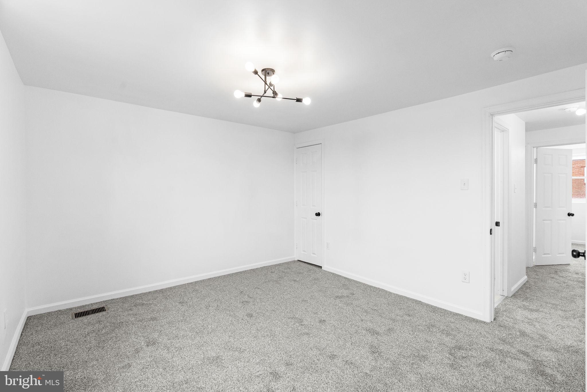 7703 Gilbert Street Philadelphia, PA 19150 - Photo 25 of 37 an empty room with chandelier fan