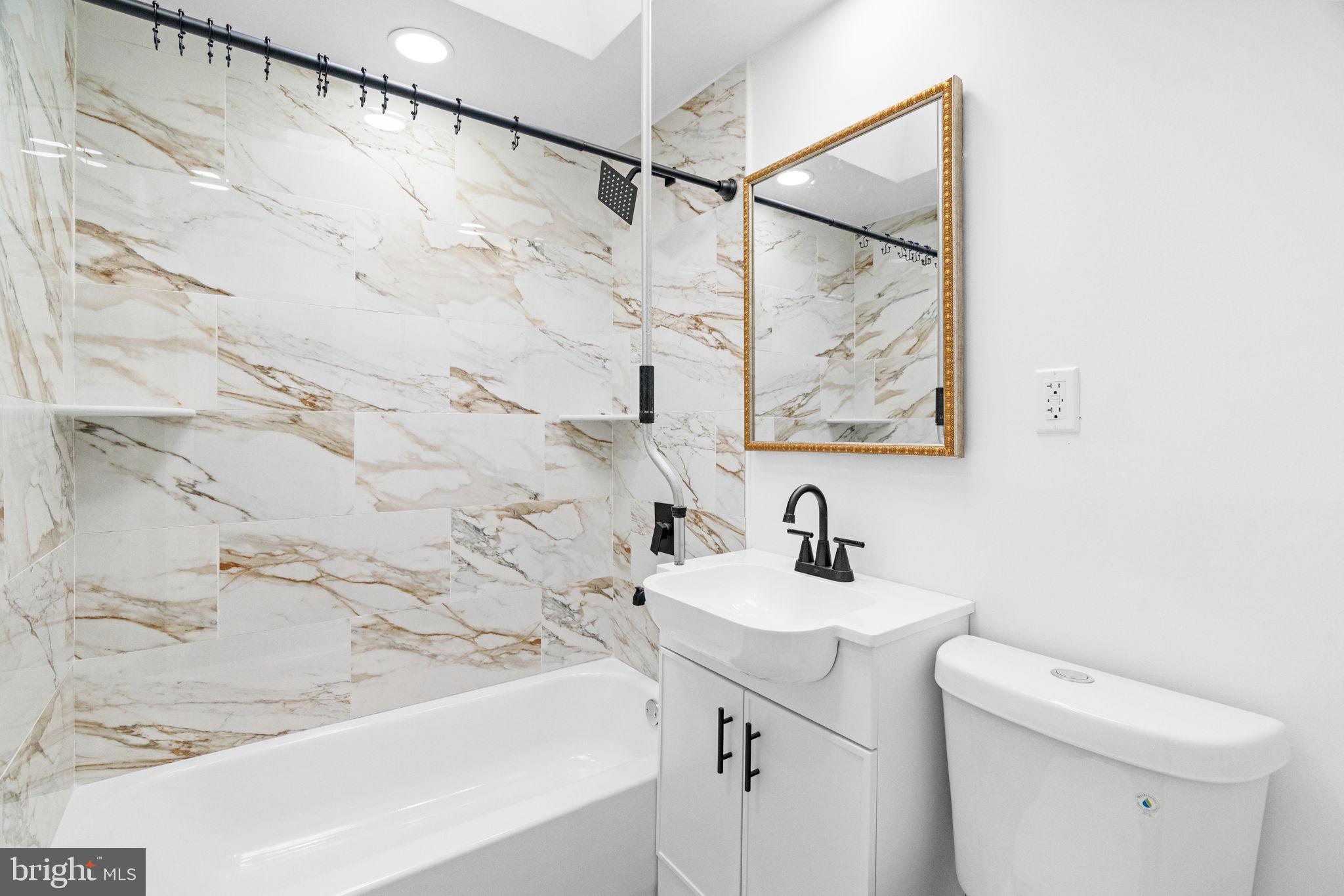 7703 Gilbert Street Philadelphia, PA 19150 - Photo 28 of 37 a bathroom with a sink and a toilet