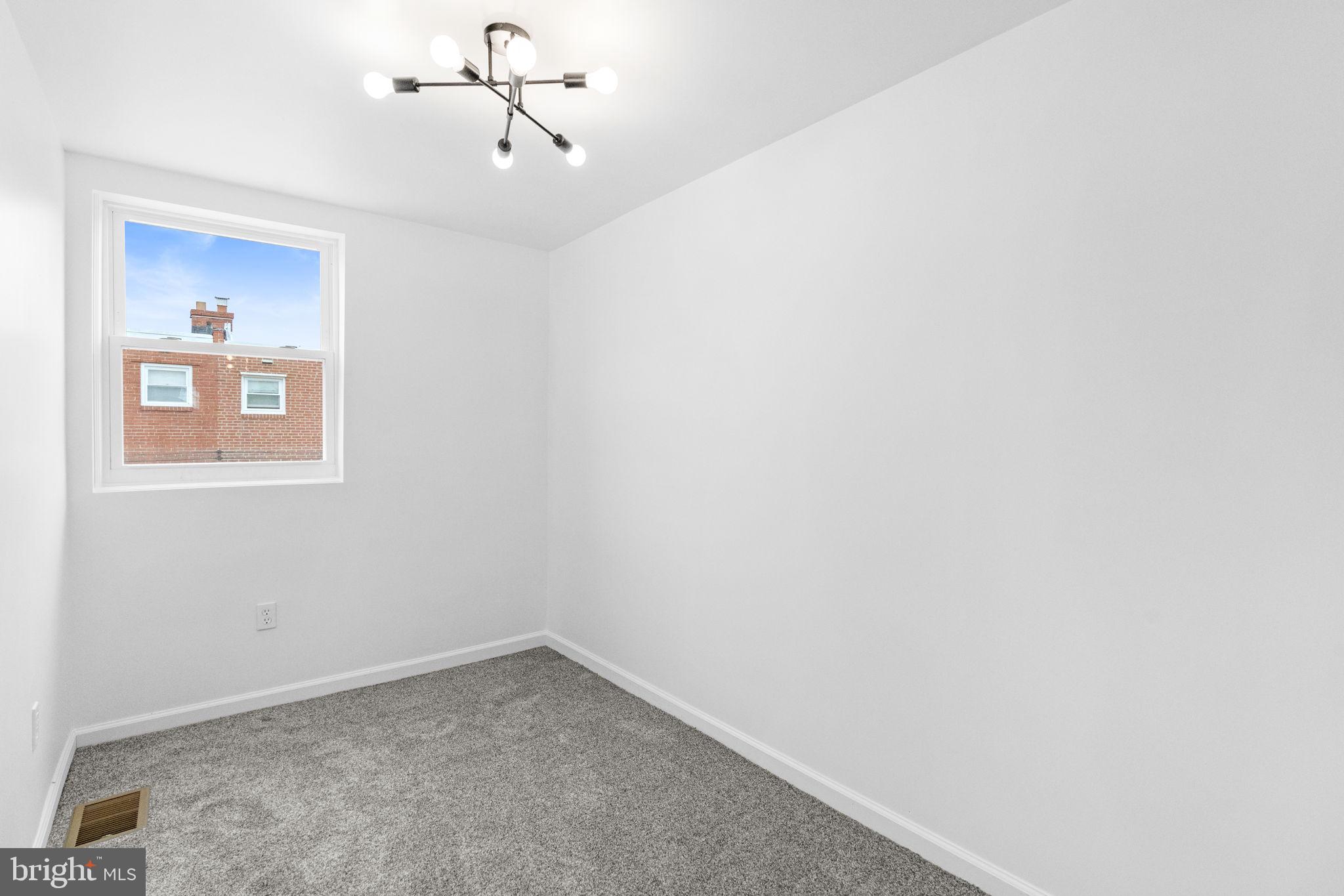 7703 Gilbert Street Philadelphia, PA 19150 - Photo 29 of 37 a view of a room with a ceiling fan and window