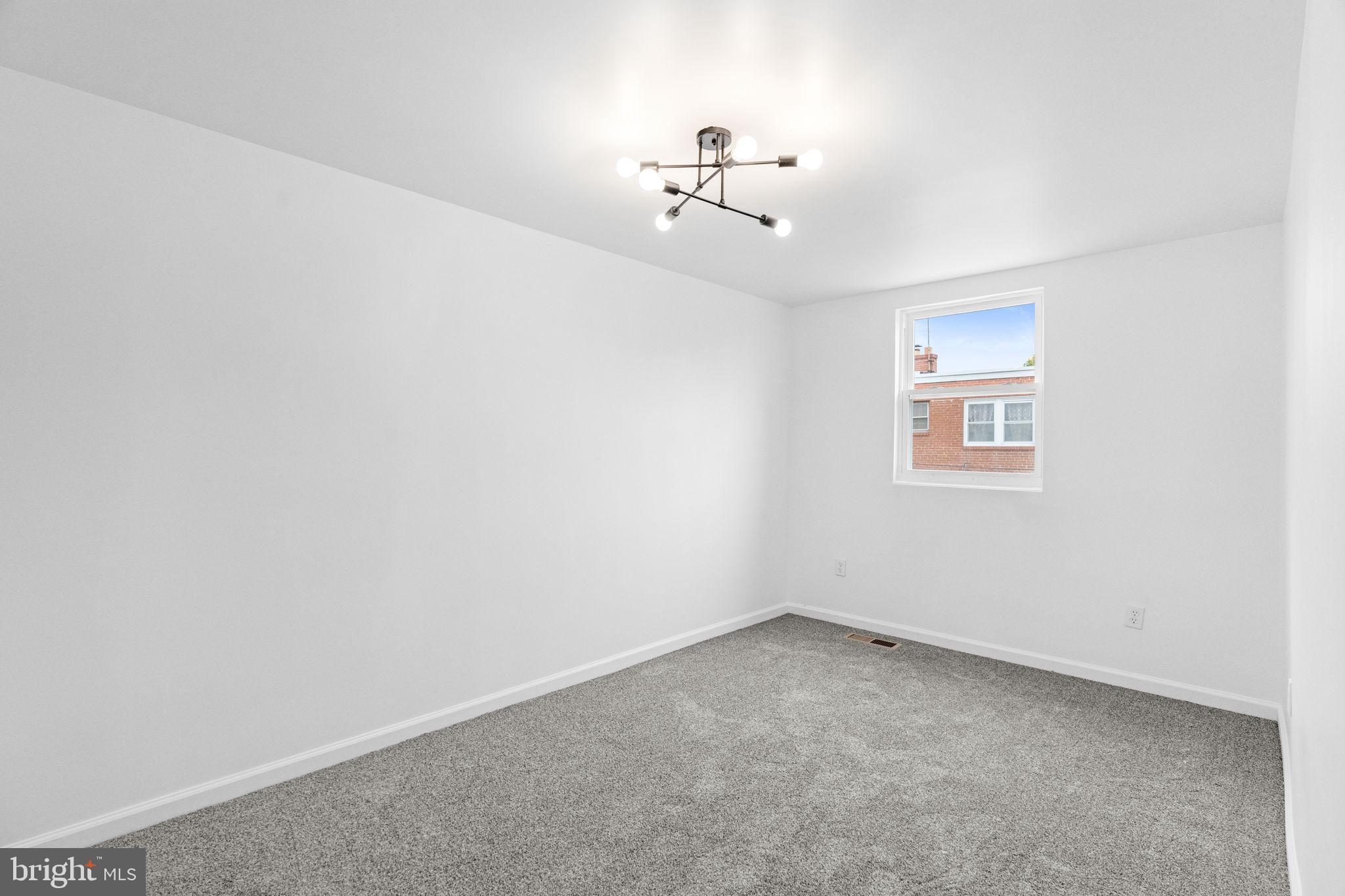 7703 Gilbert Street Philadelphia, PA 19150 - Photo 31 of 37 a view of an empty room with a chandelier fan