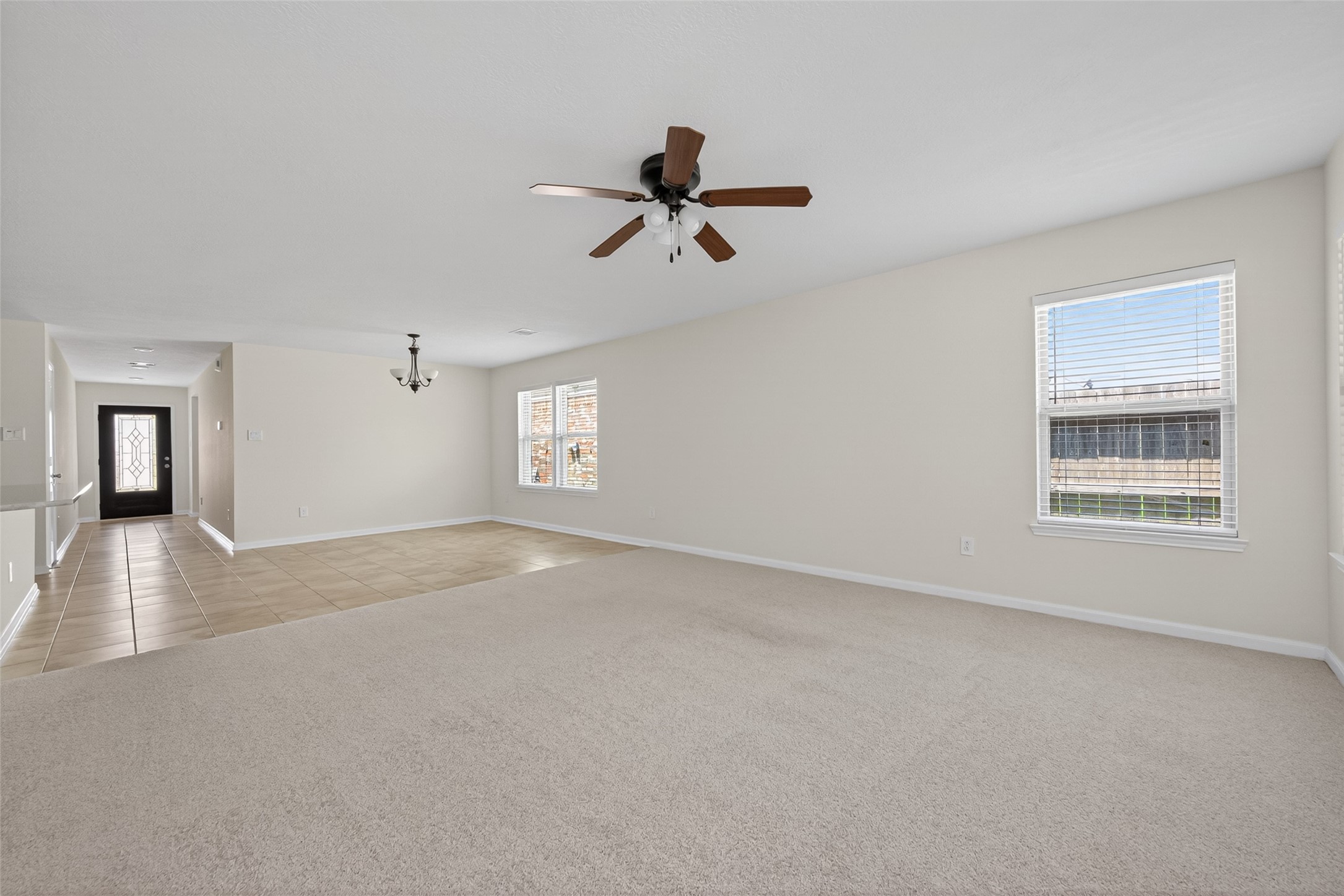 2754 Cayden Creek Way Conroe, TX 77304 - Photo 10 of 40 a view of a livingroom with a ceiling fan and window