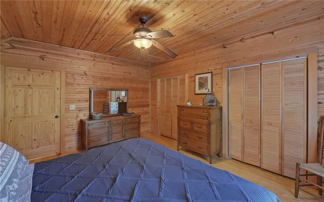 a room with a bed and a walk in closet