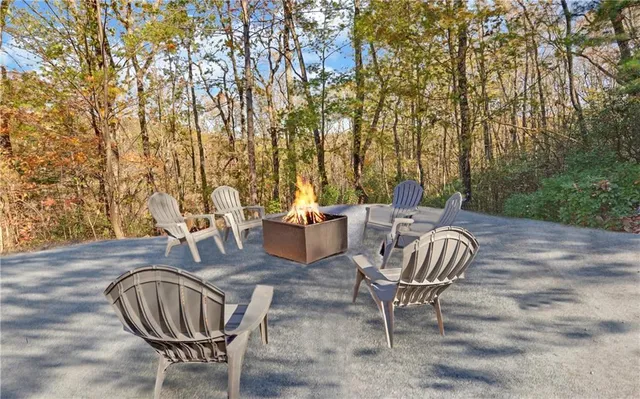 a view of a patio with table and chairs