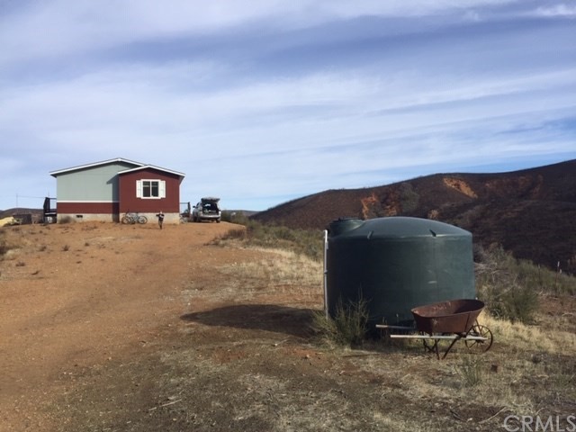 25432 Jerusalem Grde Lower Lake, CA 95457 - Photo 13 of 27 a view of a fireplace in the middle of a yard