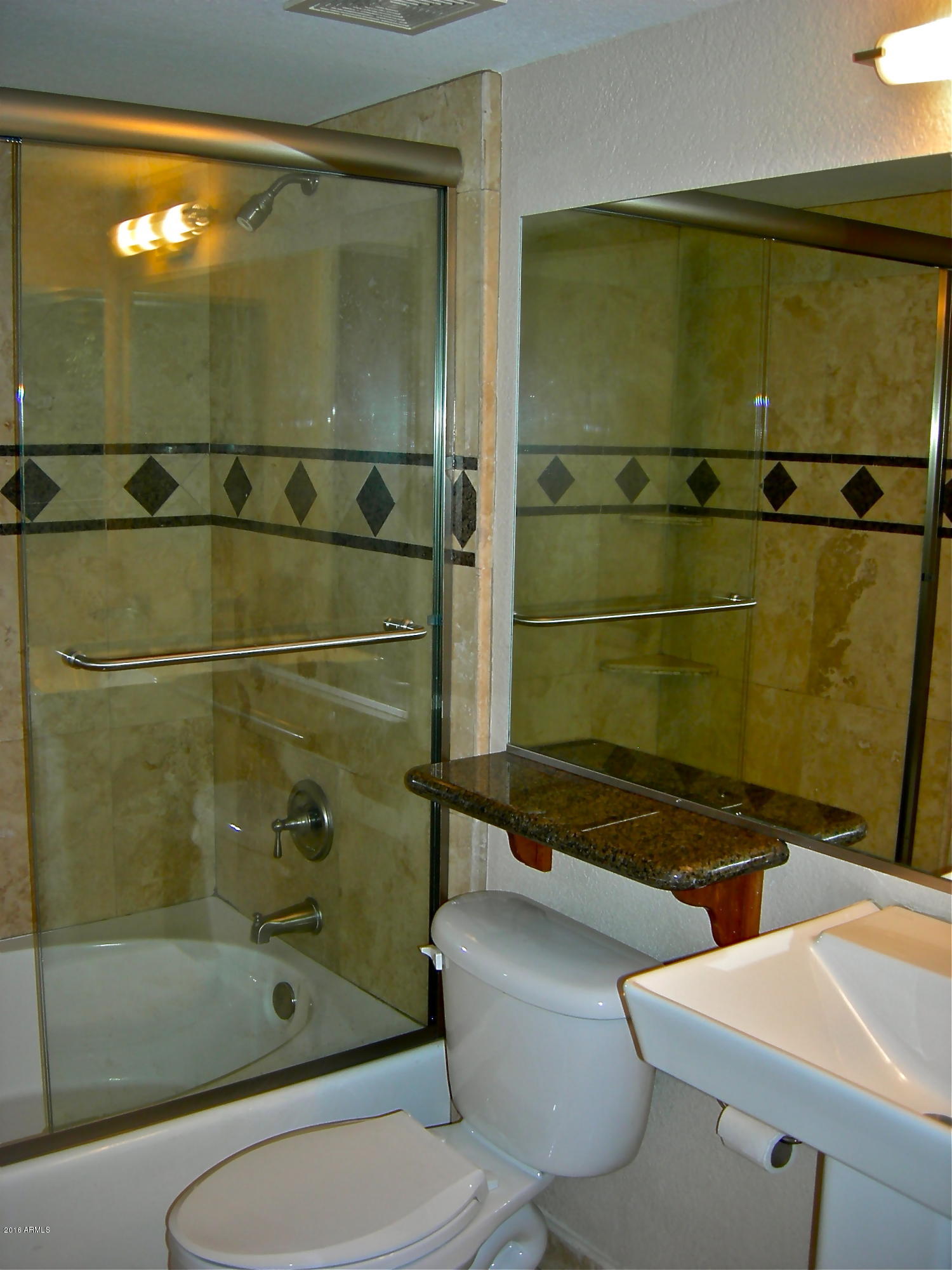 3235 East Camelback Road, Unit 213 Phoenix, AZ 85018 - Photo 26 of 43 Master Bath's stone detailing