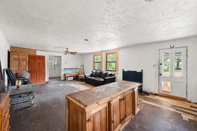 a view of bedroom with furniture and a window