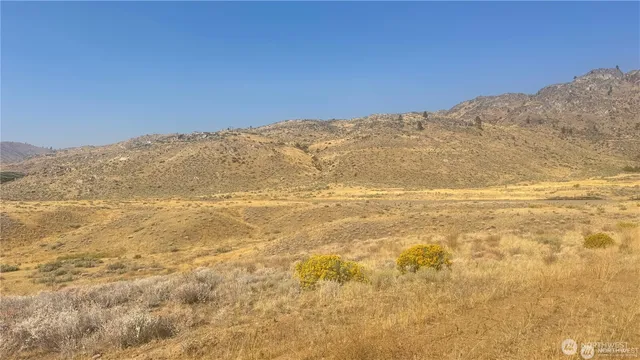 a view of ocean and mountains