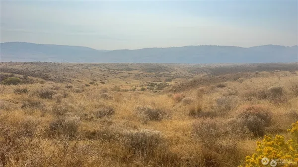 a view of ocean and mountain