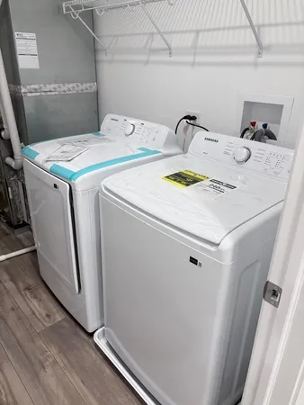 a utility room with dryer and washer