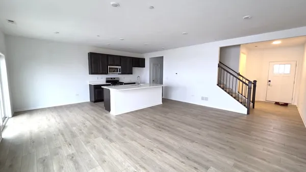 a view of a kitchen with a sink and a stove top oven