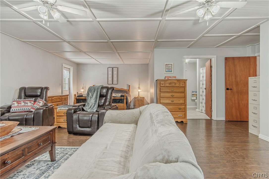 15384 Fuller Road Adams, NY 13606 - Photo 44 of 50 Rich wood-textured flooring flows through this versatile, open living and sleeping space.
