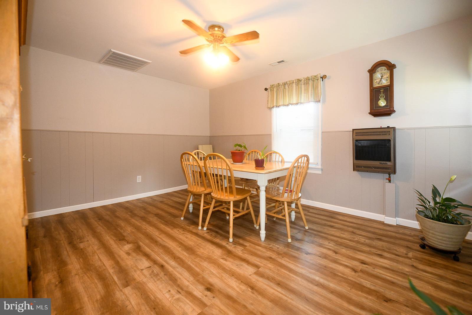 17309 Piney Point Road Piney Point, MD 20674 - Photo 11 of 38 a dining room with furniture and wooden floor