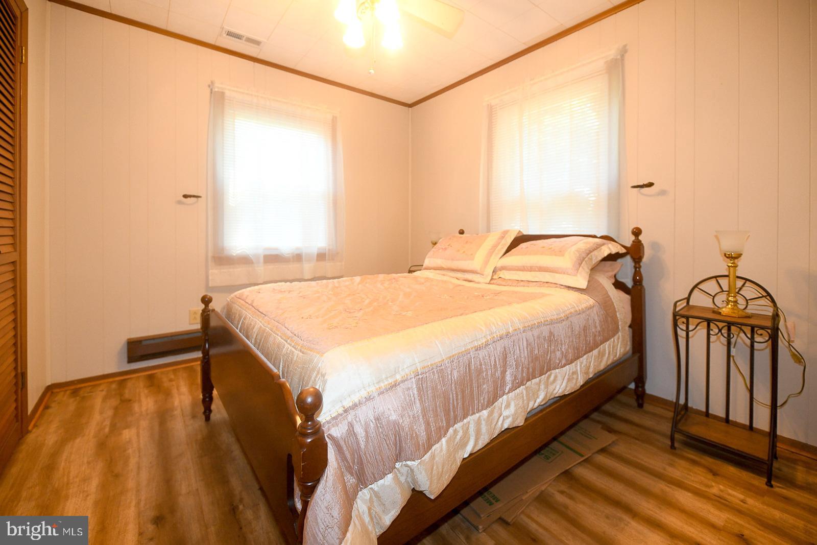 17309 Piney Point Road Piney Point, MD 20674 - Photo 15 of 38 a bedroom with a bed and a window