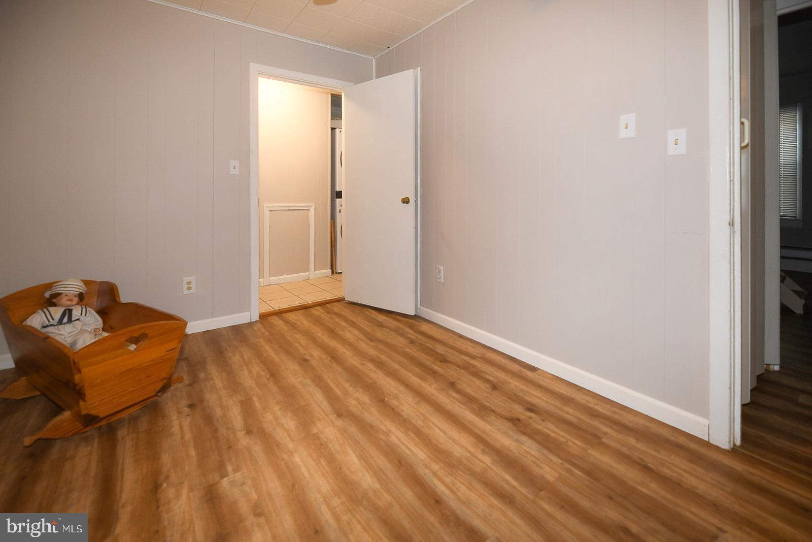 17309 Piney Point Road Piney Point, MD 20674 - Photo 20 of 38 a view of a livingroom with wooden floor and closet