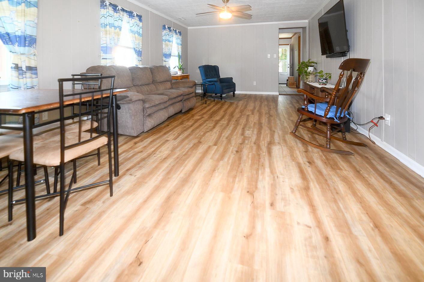 17309 Piney Point Road Piney Point, MD 20674 - Photo 2 of 38 a living room with furniture and a wooden floor