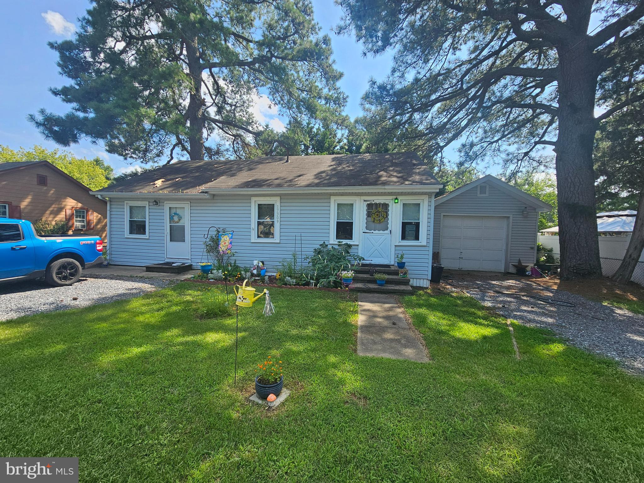 17309 Piney Point Road Piney Point, MD 20674 - Photo 24 of 38 a front view of house with yard and green space