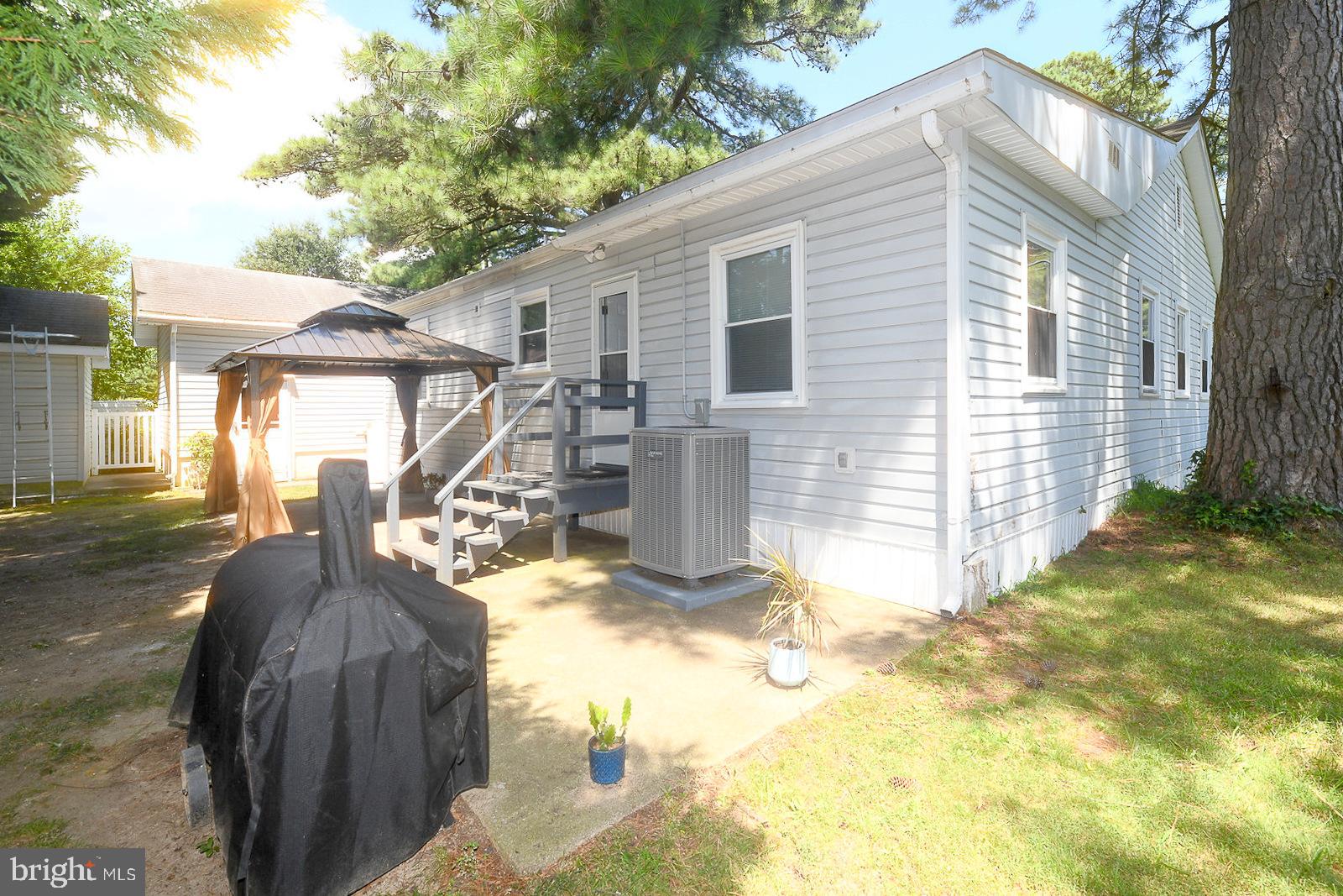 17309 Piney Point Road Piney Point, MD 20674 - Photo 27 of 38 a view of a house with backyard and sitting area