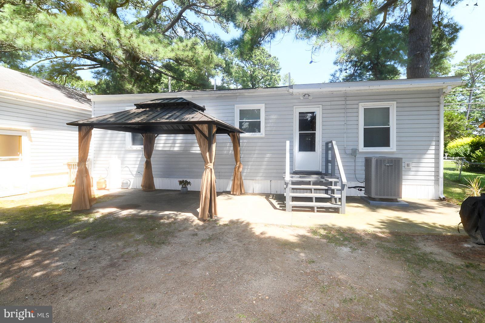 17309 Piney Point Road Piney Point, MD 20674 - Photo 28 of 38 a view of a house with a yard and large tree