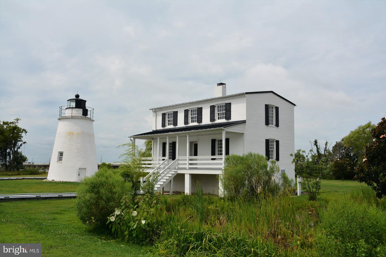 17309 Piney Point Road Piney Point, MD 20674 - Photo 32 of 38 a view of a house with a yard