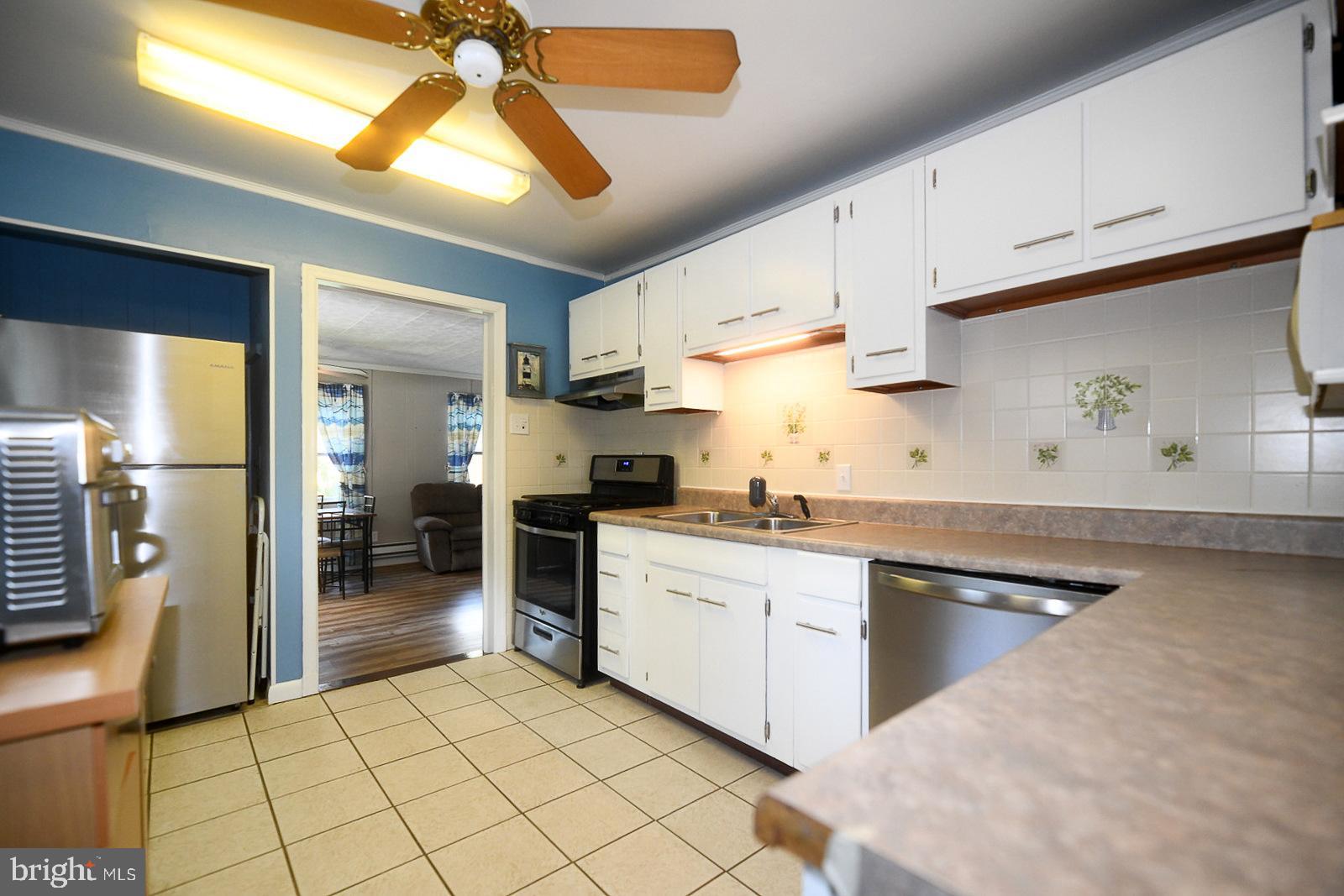 17309 Piney Point Road Piney Point, MD 20674 - Photo 9 of 38 a kitchen with appliances cabinets and a sink
