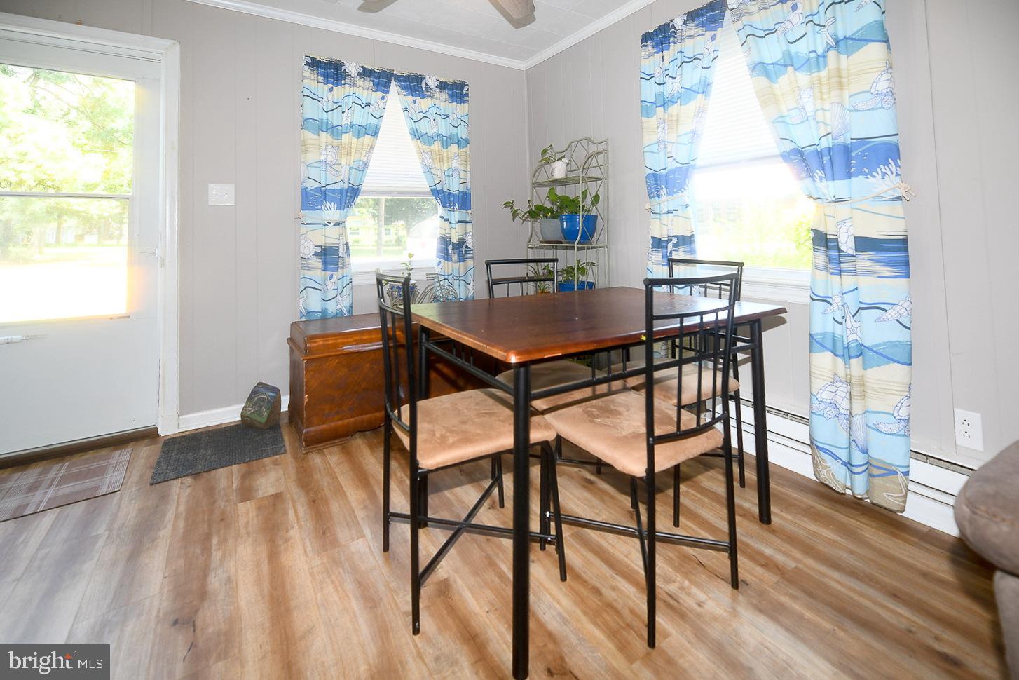 17309 Piney Point Road Piney Point, MD 20674 - Photo 10 of 38 a dining room with furniture and window