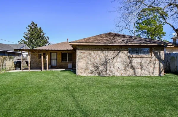 a view of front of a house with a garden