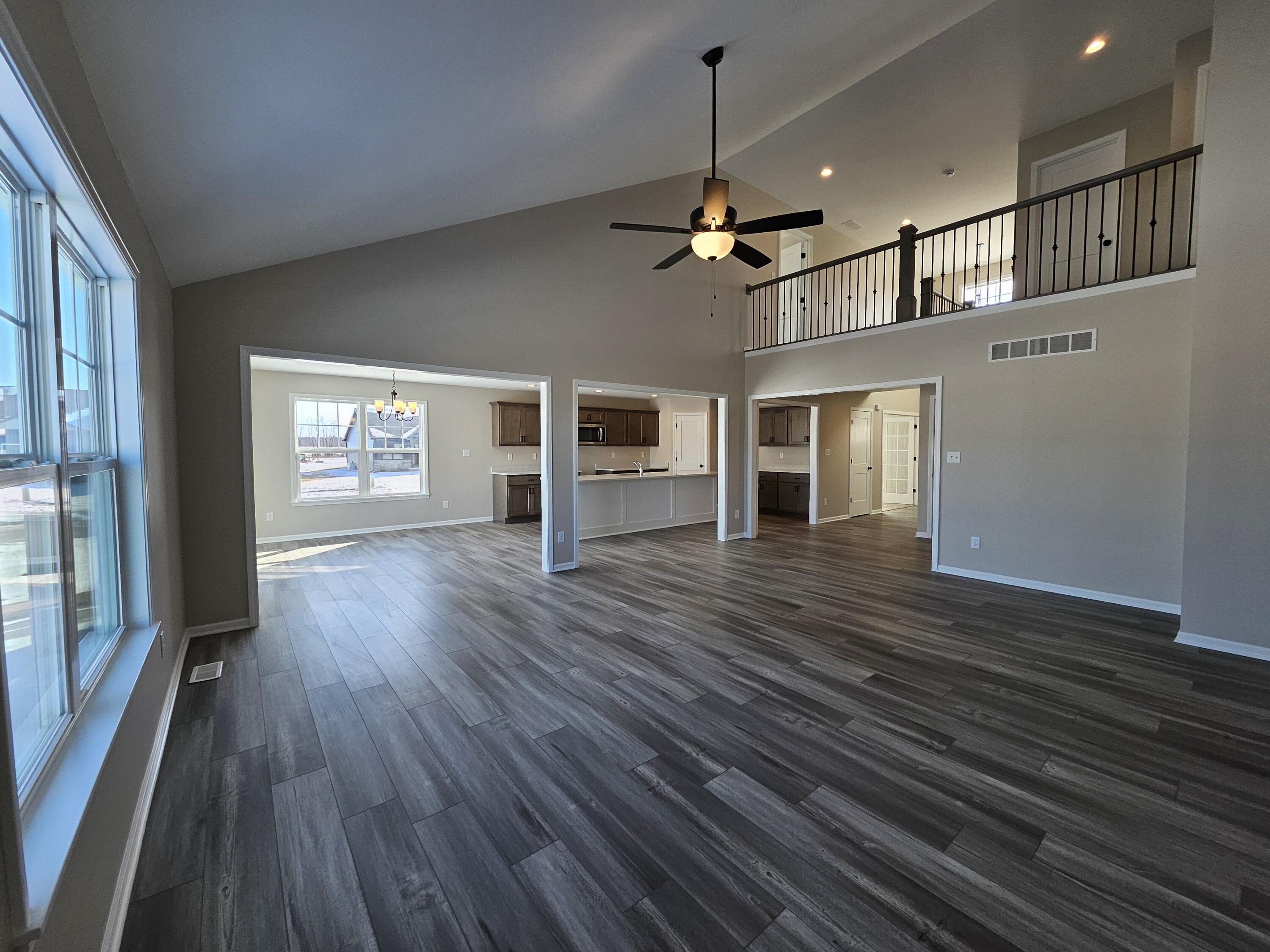 5012 Stephen Lane Lowell, IN 46356 - Photo 11 of 46 a view of empty room with wooden floor and fireplace