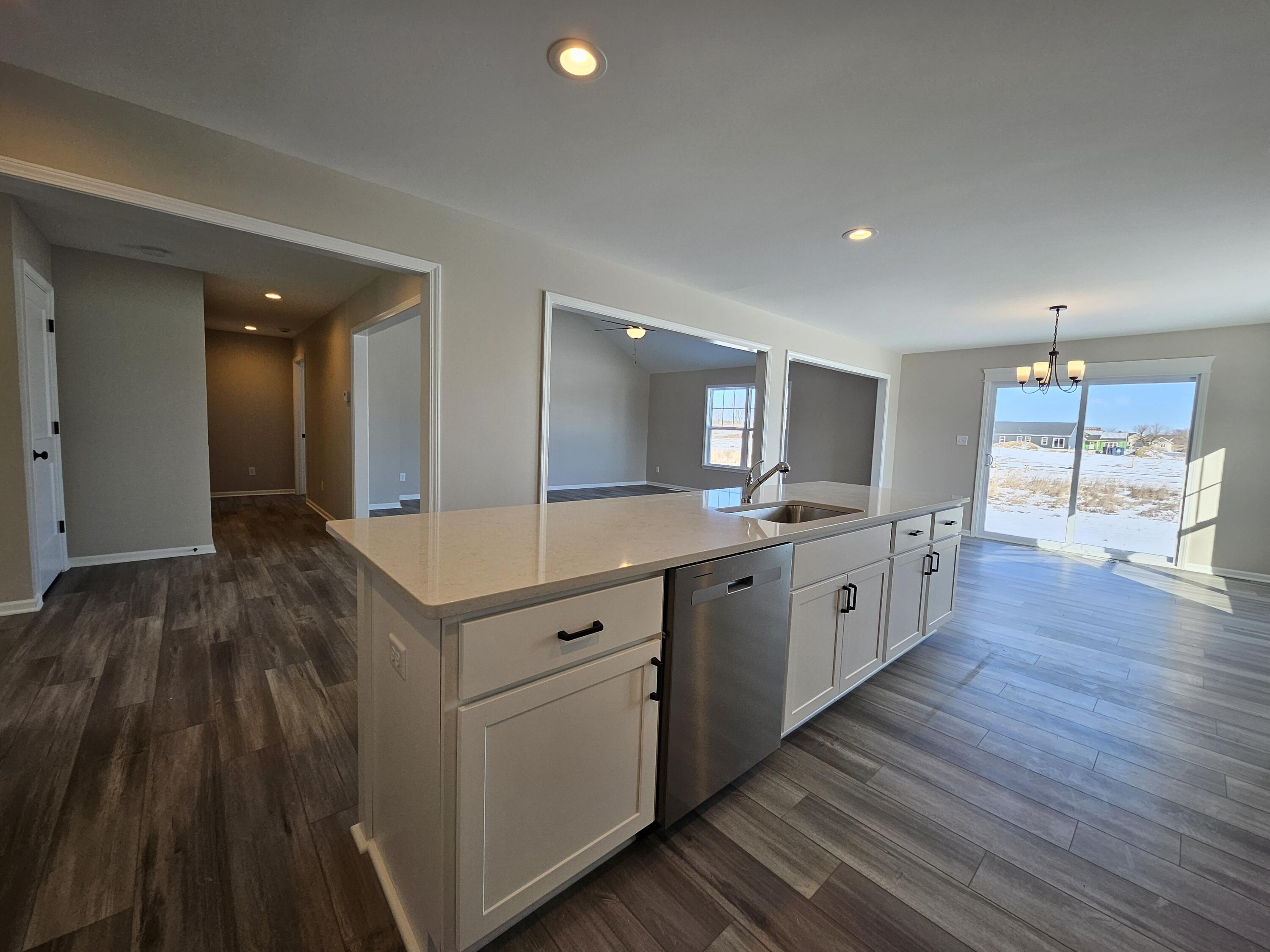 5012 Stephen Lane Lowell, IN 46356 - Photo 18 of 46 a large kitchen with stainless steel appliances granite countertop a lot of counter space and wooden floors