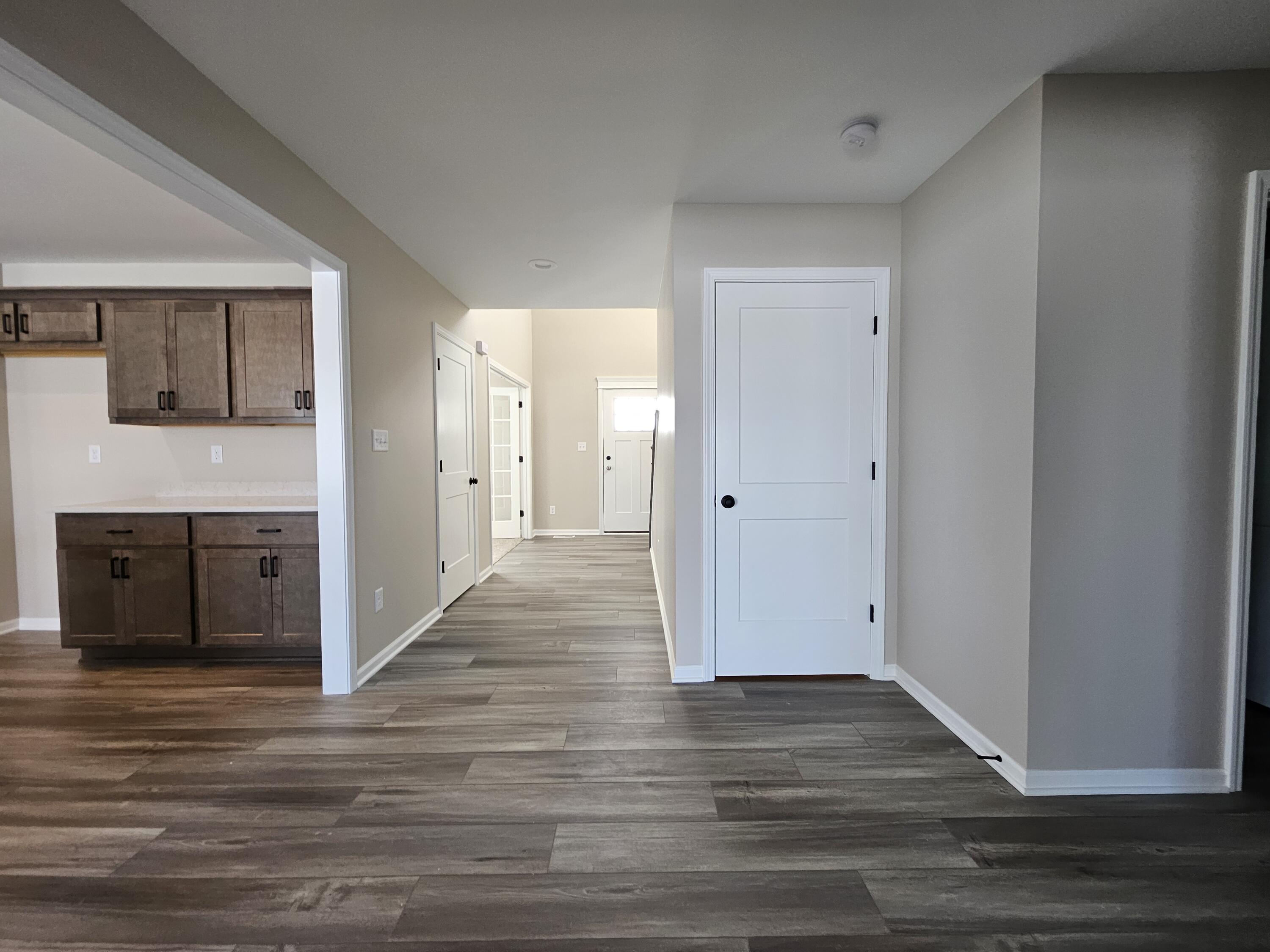 5012 Stephen Lane Lowell, IN 46356 - Photo 21 of 46 a view of an empty room with wooden floor and a fireplace