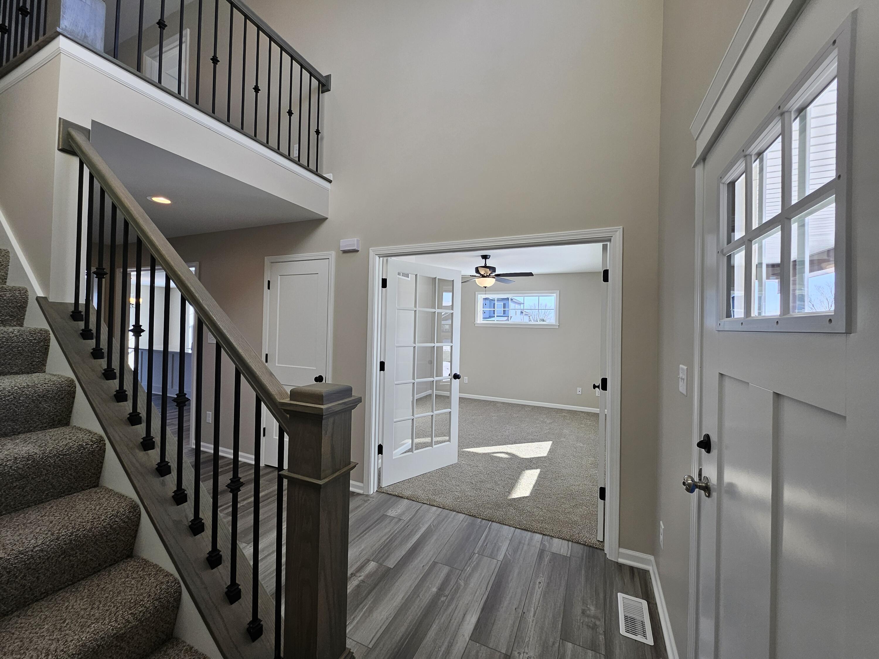 5012 Stephen Lane Lowell, IN 46356 - Photo 4 of 46 a view of staircase with wooden floor and staircase