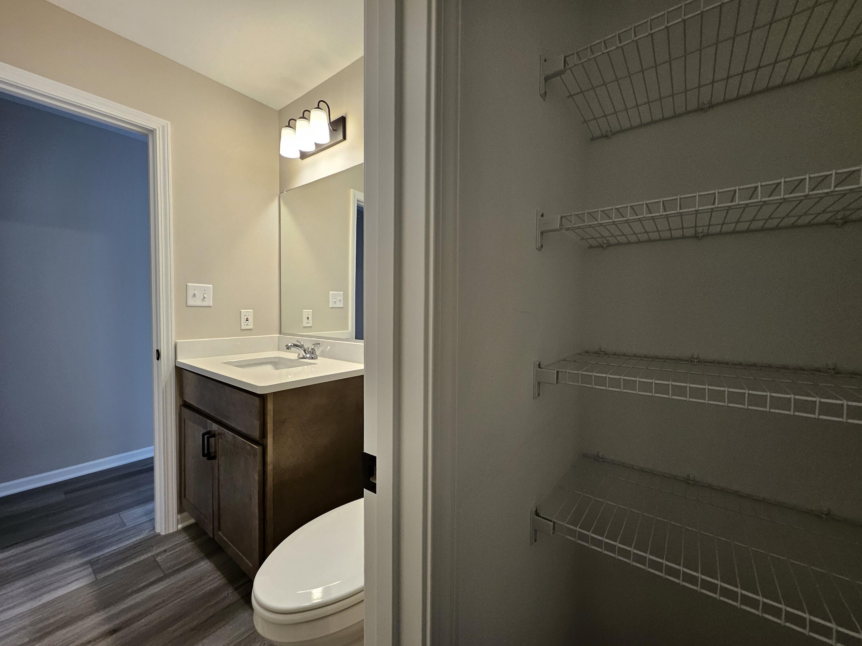 5012 Stephen Lane Lowell, IN 46356 - Photo 41 of 46 a bathroom with a toilet a sink and a window