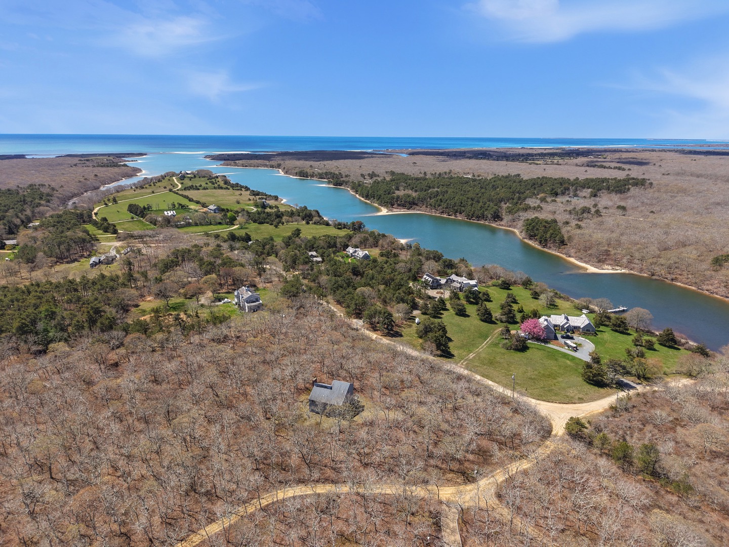82 Oyster Pond Road Edgartown, MA 02539 - Photo 42 of 53 a view of a lake with a mountain in the background