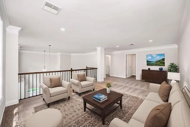 a front view of a house with a garden and plants