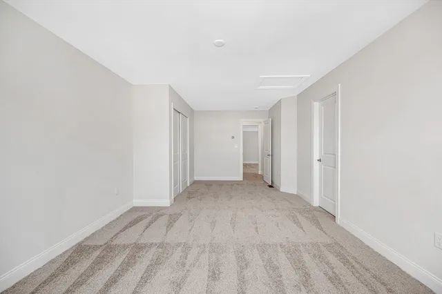 an aerial view of a house with garden space and lake view