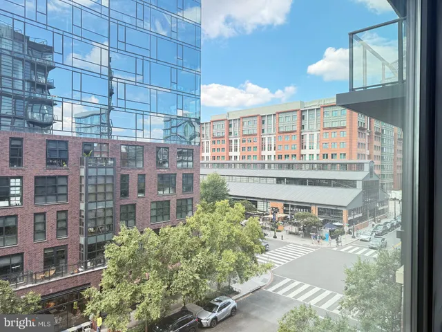 a front view of a building with a garden