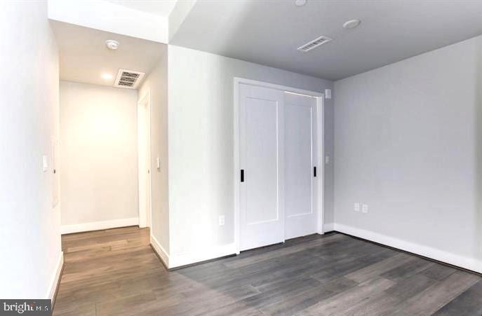 1300 4th Street Southeast, Unit 402 Washington, DC 20003 - Photo 9 of 27 Spacious, modern bedroom with natural light.