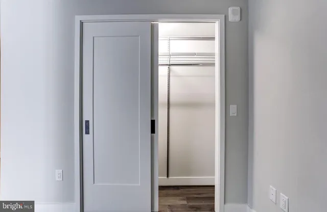 a bathroom with a glass shower door
