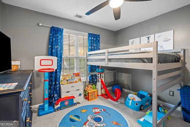 a children room with toys and a couch