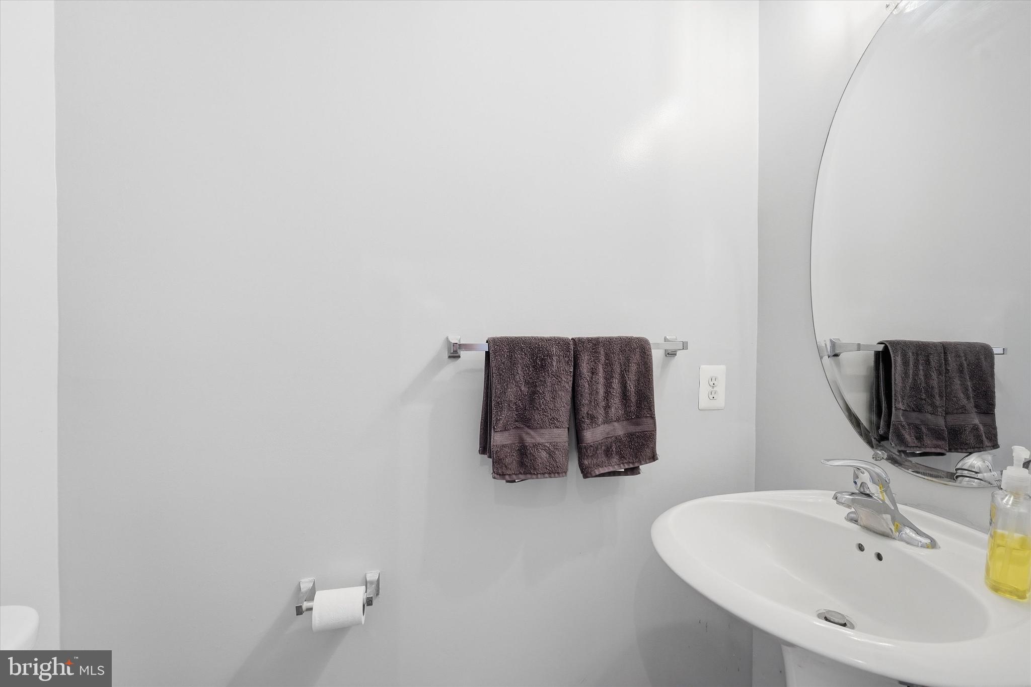 24 Overbrook Road Ranson, WV 25438 - Photo 8 of 21 a bathroom with a sink and a mirror