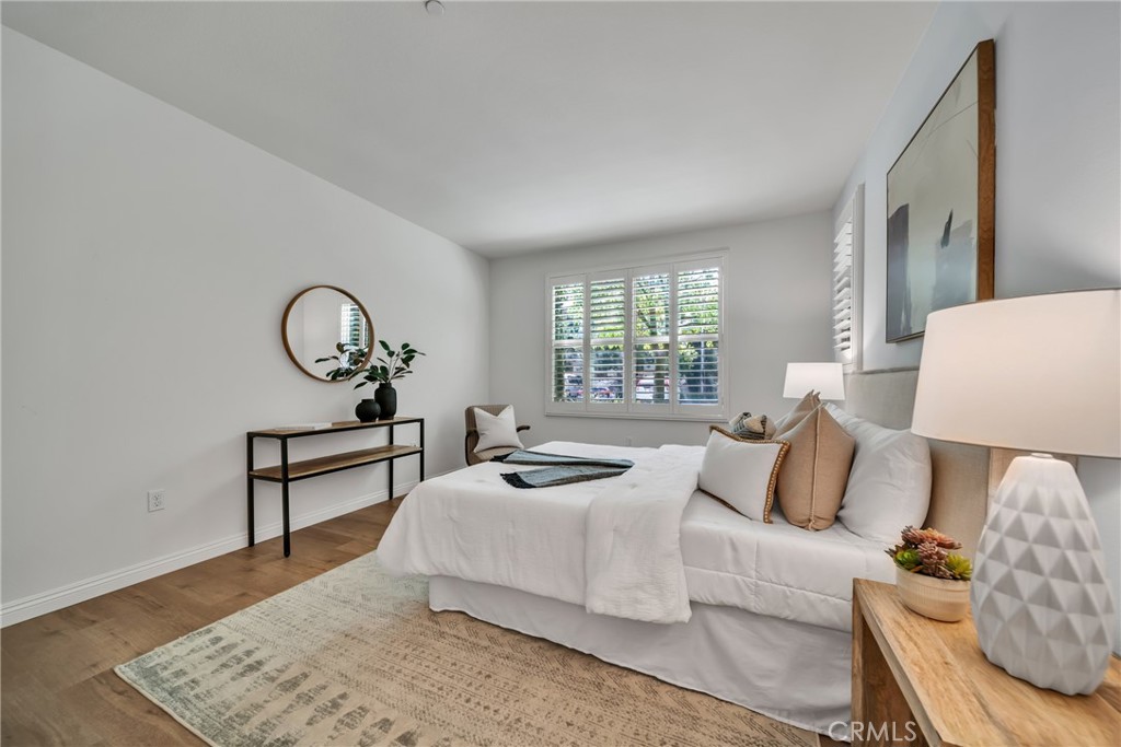 113 Mayfair Irvine, CA 92620 - Photo 19 of 31 a bedroom with bed and a window